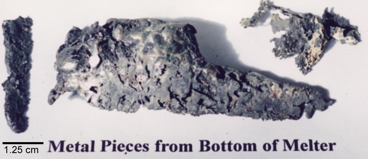 Figure 4b. Metal ingot containing irregular shaped globs or drips removed from the bottom of the melter.