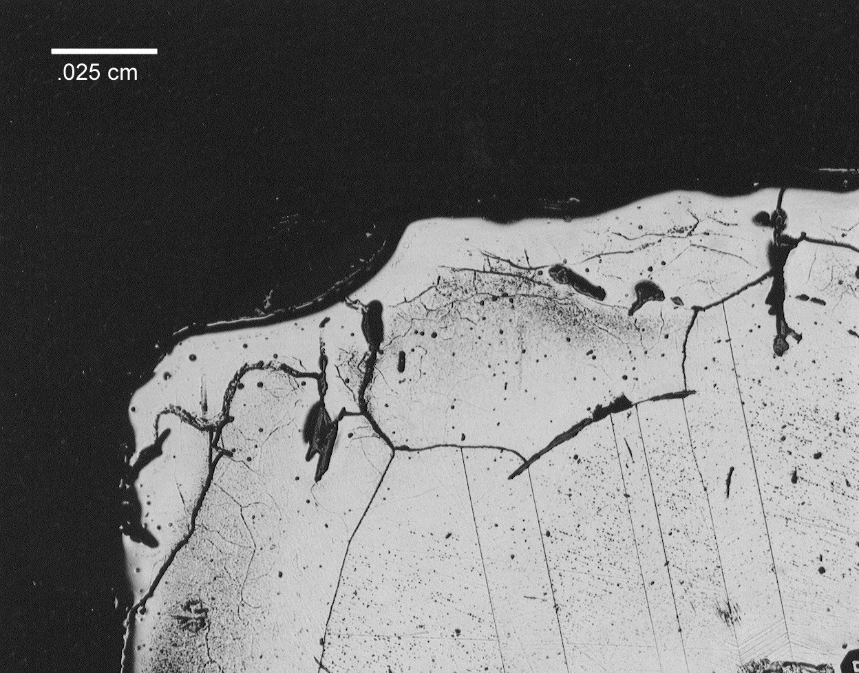 Figure 6a. Photomicrographs of specimen sectioned from melted end on 690 electrode sheath. Light area around outer edge shows melted 690. Molybdenum was not found in this region.