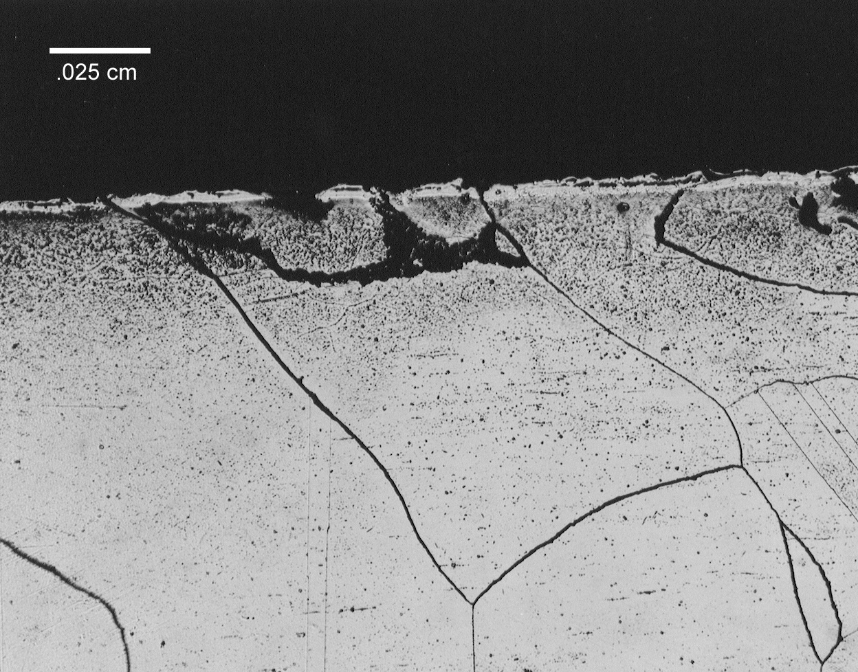 Figure 6b. Photomicrographs of specimen sectioned from melted end on 690 electrode sheath. Extremely large grains in excess of 0.13 cm were common in this region.