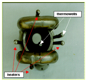 Figure 6. Photograph of bottom view of the FTB center pipe bundle prior to placement in can. The center pipe is sandwiched by the two 1-inch  U-shaped cooling tubes. Four heater wells surround the center pipe. One thermowell is inside the center pipe, the other in the annular space. 