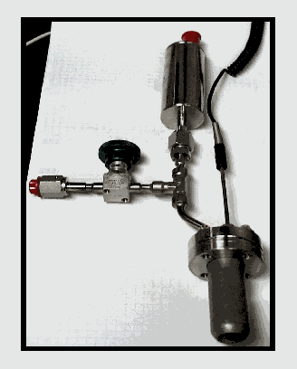 Figure 1. Test Apparatus used to Measure Gas Generation rates for PuO2
