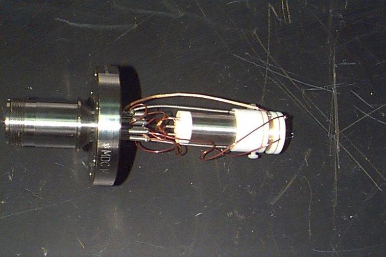 Figure 12. Close-up view of the miniature ion trap with Amptek electron multiplier detector. RF leakage across wiring was a problem in this design.