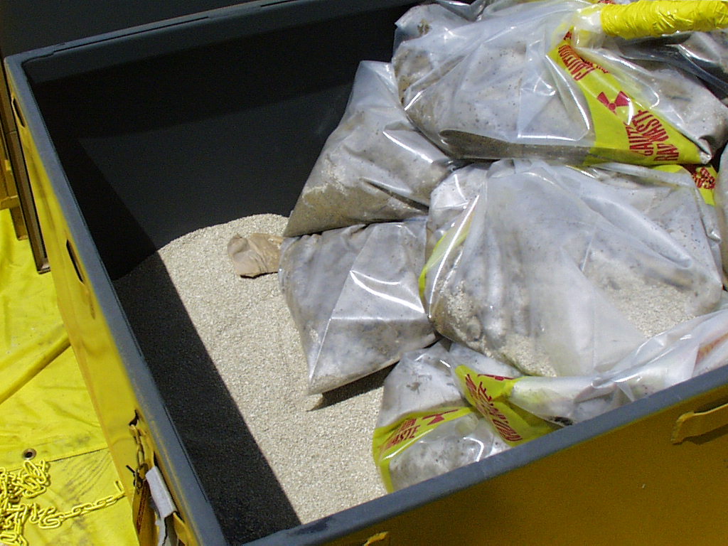 Cover Photograph: Provided by Wally Walliser. Packaging of Spent GT-73 Resin Generated from the Effluent Treatment Facility. The Tan Granular Material is Water Absorbent Placed at the Bottom of B-12 Disposal Box and within each Polyethylene Bag Holding the Spent GT-73 Resin, the Darker Brown Material.